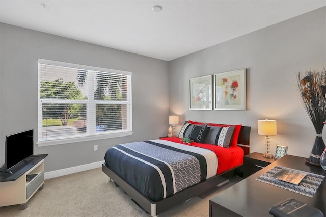 3430 77th St W Unit 103, Bradenton, FL 34209 - bedroom with baseboards and carpet flooring