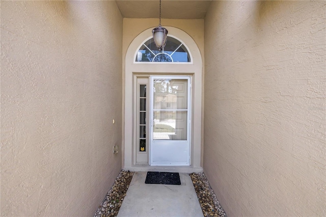 2499 Trimble Ave, North Port, FL 34288 - doorway to property featuring stucco siding