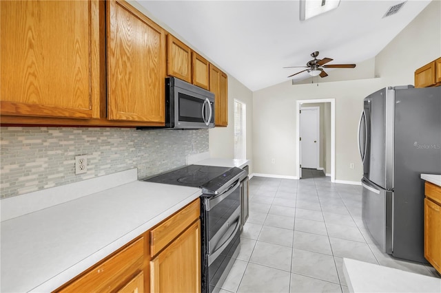 2499 Trimble Ave, North Port, FL 34288 - kitchen with appliances with stainless steel finishes, decorative backsplash, vaulted ceiling, a ceiling fan, and light countertops