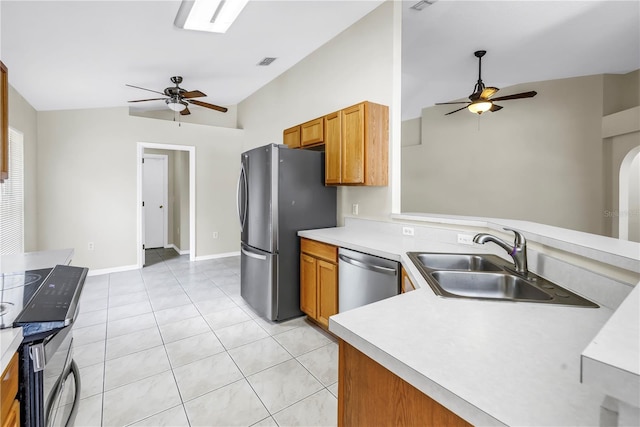 2499 Trimble Ave, North Port, FL 34288 - kitchen featuring a ceiling fan, vaulted ceiling, stainless steel appliances, a sink, and light countertops
