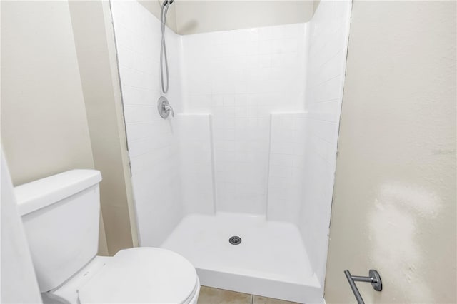 2499 Trimble Ave, North Port, FL 34288 - bathroom featuring toilet, a shower stall, and tile patterned floors