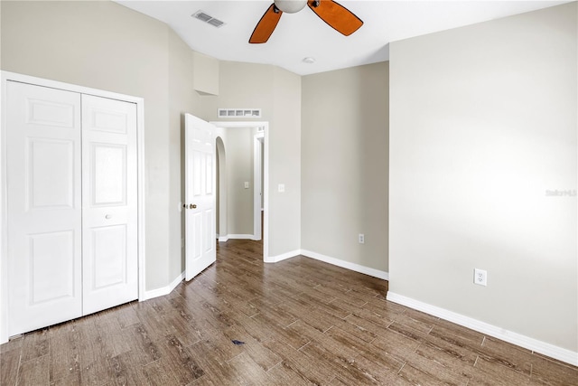 2499 Trimble Ave, North Port, FL 34288 - unfurnished bedroom with wood finished floors, a closet, baseboards, and ceiling fan