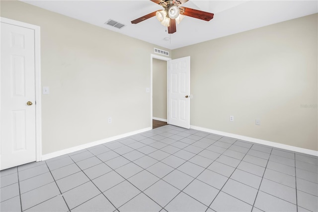 2499 Trimble Ave, North Port, FL 34288 - empty room featuring a ceiling fan, baseboards, and light tile patterned flooring