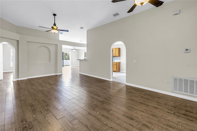 2499 Trimble Ave, North Port, FL 34288 - unfurnished living room with a ceiling fan, arched walkways, and dark wood finished floors
