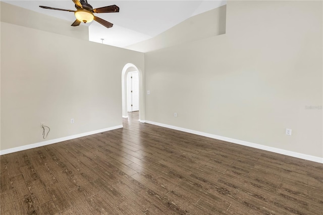 2499 Trimble Ave, North Port, FL 34288 - spare room with a ceiling fan, lofted ceiling, dark wood finished floors, arched walkways, and baseboards