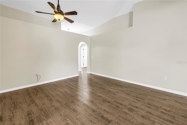 2499 Trimble Ave, North Port, FL 34288 - unfurnished room with arched walkways, ceiling fan, dark wood-style floors, baseboards, and high vaulted ceiling