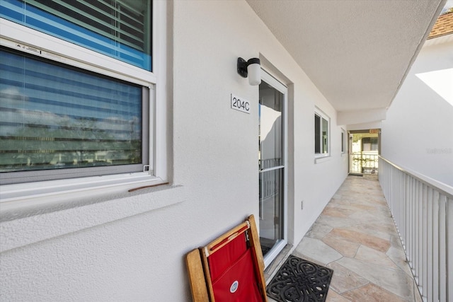 property entrance featuring stucco siding