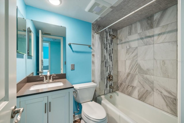 full bathroom featuring shower / bath combination with curtain, vanity, and toilet
