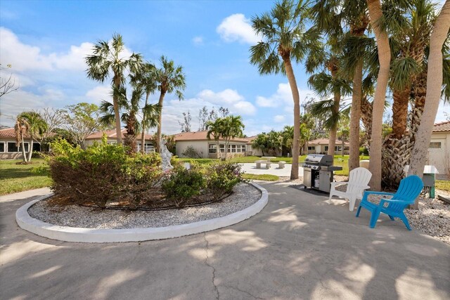 view of property's community with a patio and a residential view