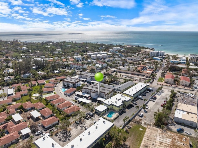 aerial view of property's location with a nearby body of water