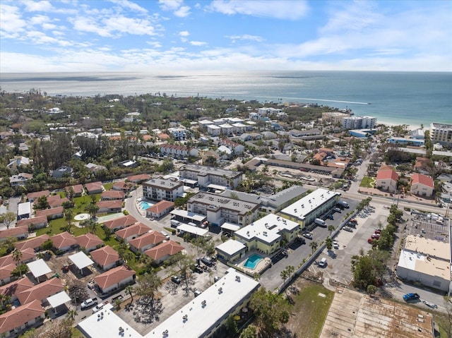 aerial view of property's location with a nearby body of water