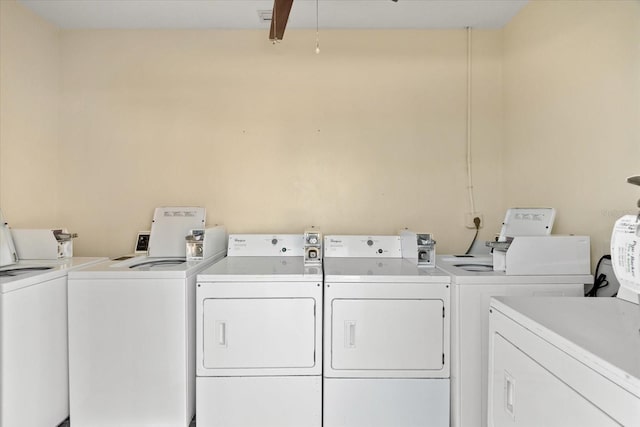 community laundry with separate washer and dryer and ceiling fan