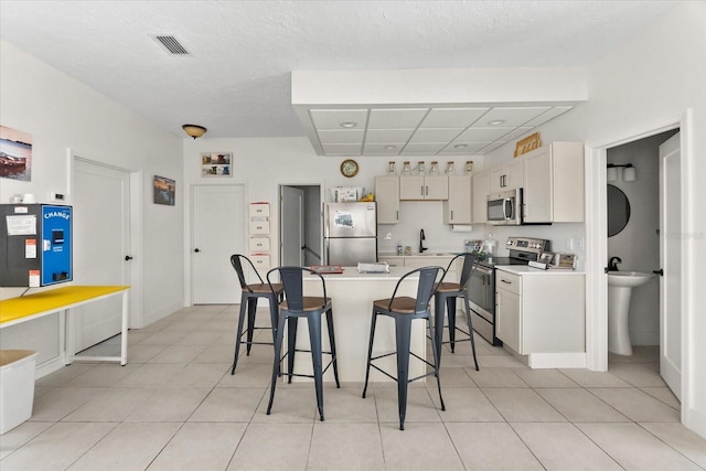 dining room with light tile patterned flooring and baseboards