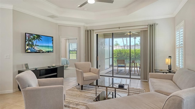 229 Alento Ct, Nokomis, FL 34275 - living room with ceiling fan, a raised ceiling, light tile patterned flooring, ornamental molding, and baseboards