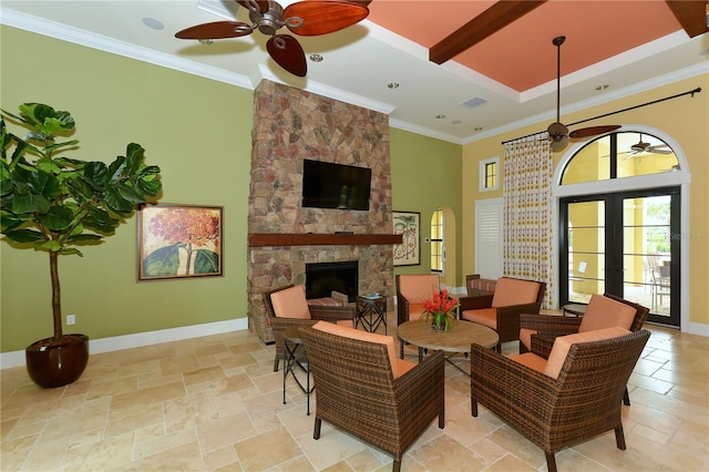 229 Alento Ct, Nokomis, FL 34275 - living area featuring a ceiling fan, a fireplace, a high ceiling, baseboards, and beamed ceiling