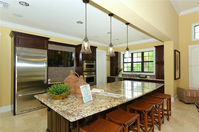 229 Alento Ct, Nokomis, FL 34275 - kitchen featuring stainless steel appliances, healthy amount of natural light, light stone countertops, and ornamental molding