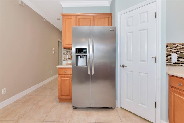 11455 52nd Ct E, Parrish, FL 34219 - kitchen featuring stainless steel fridge with ice dispenser, backsplash, ornamental molding, light countertops, and light tile patterned floors