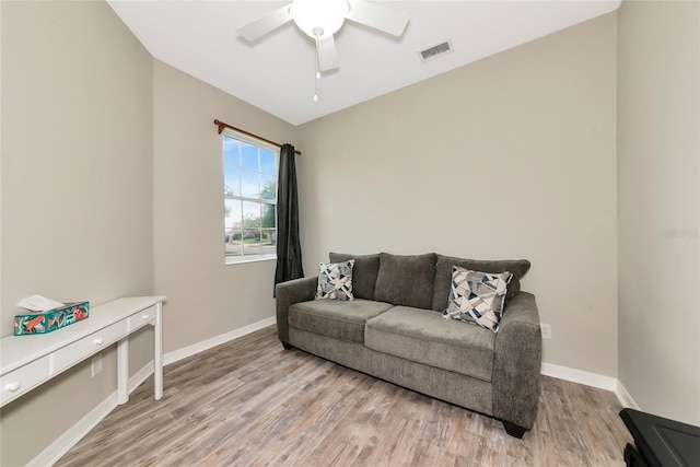 11455 52nd Ct E, Parrish, FL 34219 - living area with light wood finished floors, baseboards, and a ceiling fan