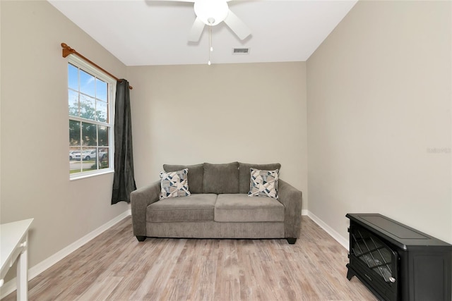 11455 52nd Ct E, Parrish, FL 34219 - living area featuring light wood-style floors, baseboards, and a ceiling fan