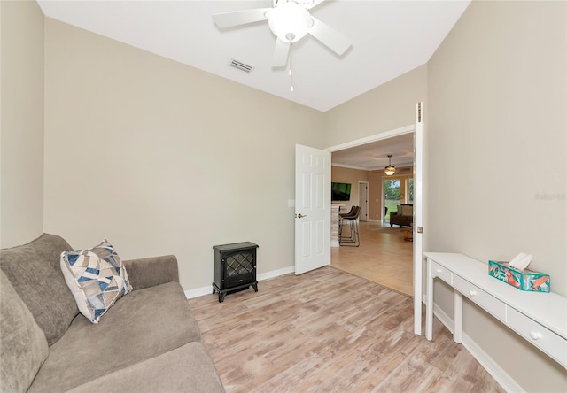 11455 52nd Ct E, Parrish, FL 34219 - living area with a ceiling fan, light wood-type flooring, and baseboards