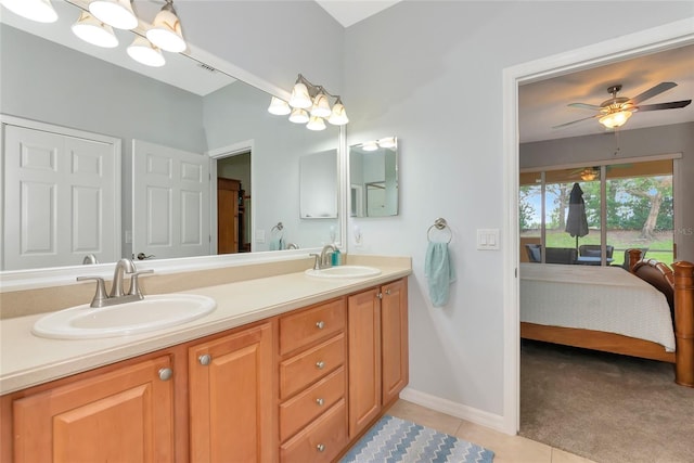 11455 52nd Ct E, Parrish, FL 34219 - full bathroom featuring connected bathroom, double vanity, ceiling fan, tile patterned flooring, and baseboards