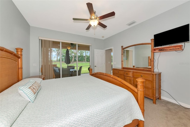11455 52nd Ct E, Parrish, FL 34219 - bedroom featuring access to exterior, light colored carpet, ceiling fan, and baseboards