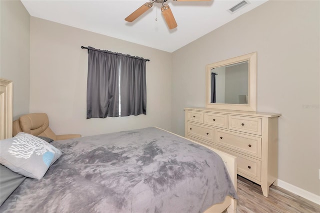 11455 52nd Ct E, Parrish, FL 34219 - bedroom with light wood-type flooring, baseboards, and a ceiling fan