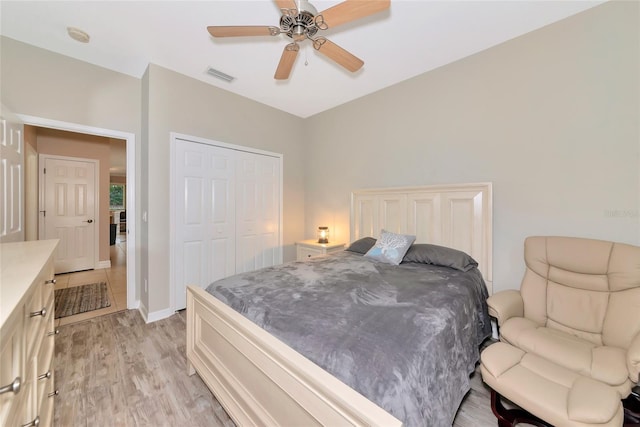 11455 52nd Ct E, Parrish, FL 34219 - bedroom with light wood-style flooring, a closet, and a ceiling fan