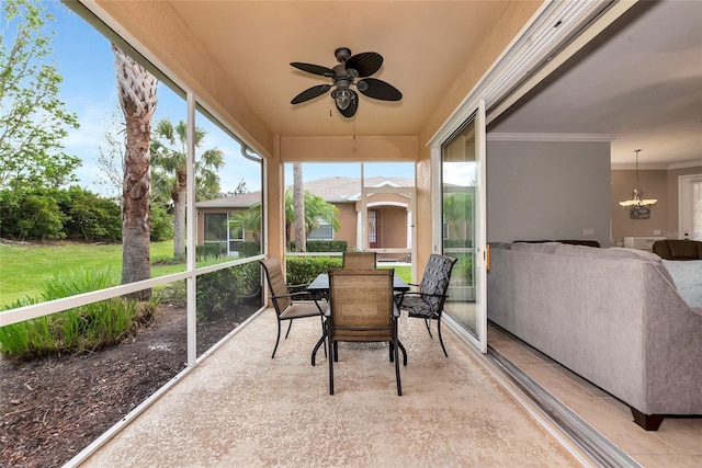 11455 52nd Ct E, Parrish, FL 34219 - sunroom featuring a ceiling fan, healthy amount of natural light, and outdoor dining area