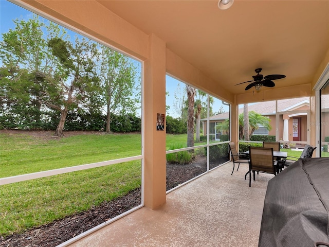 11455 52nd Ct E, Parrish, FL 34219 - sunroom / solarium with ceiling fan and outdoor dining space
