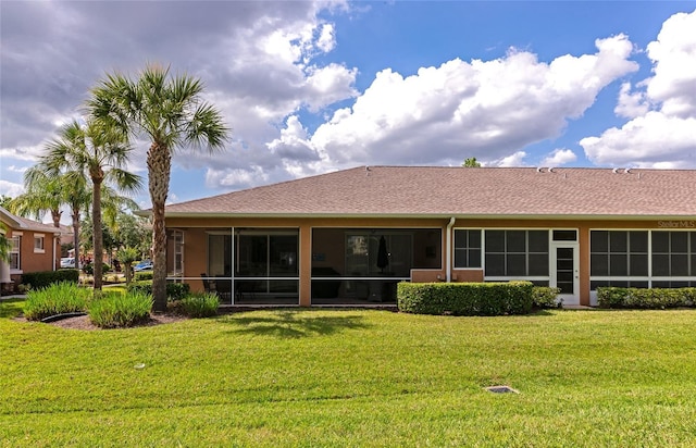 11455 52nd Ct E, Parrish, FL 34219 - rear view of house featuring a sunroom and a lawn