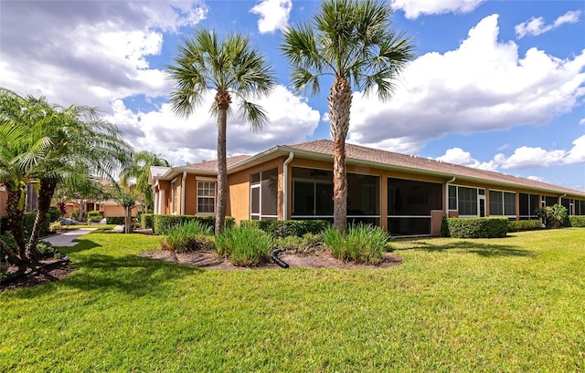 11455 52nd Ct E, Parrish, FL 34219 - back of property with a sunroom and a yard
