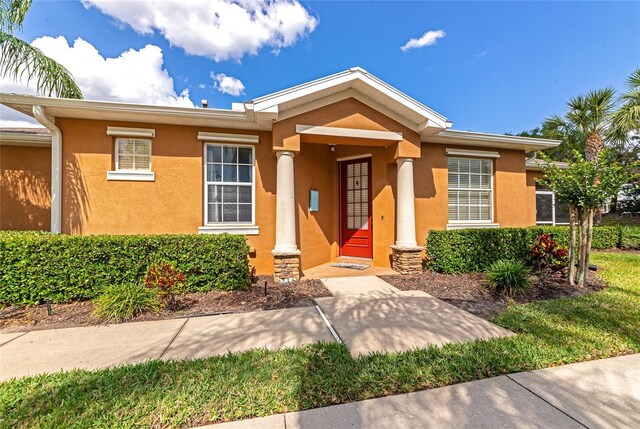 11455 52nd Ct E, Parrish, FL 34219 - view of front facade with stucco siding