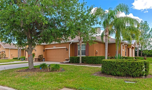 11455 52nd Ct E, Parrish, FL 34219 - view of front of home featuring stucco siding, driveway, a front yard, and an attached garage