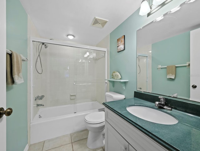 full bath with tile patterned flooring, toilet, vanity, and shower / tub combination