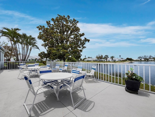 view of patio / terrace featuring outdoor dining area and a water view