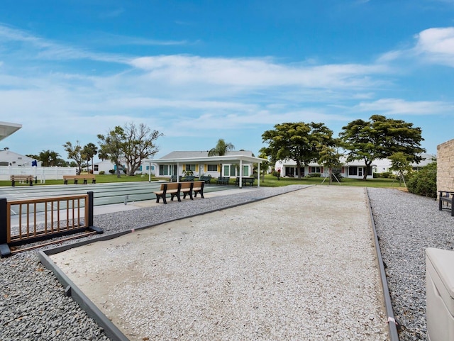 view of home's community featuring a bocce ball area and a residential view