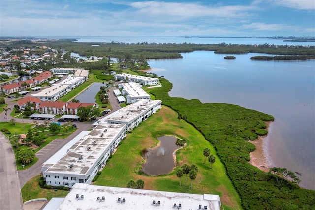 aerial view of apartment complex / building and a large body of water