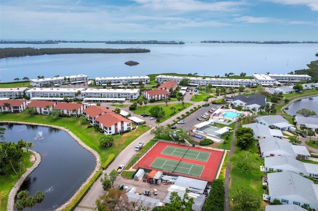 bird's eye view of a nearby body of water and apartment complex