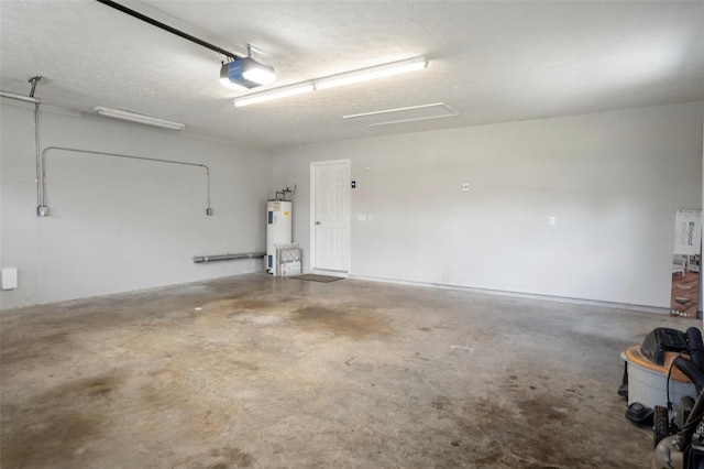 garage with a garage door opener and electric water heater