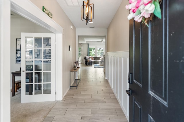 entrance foyer featuring a chandelier