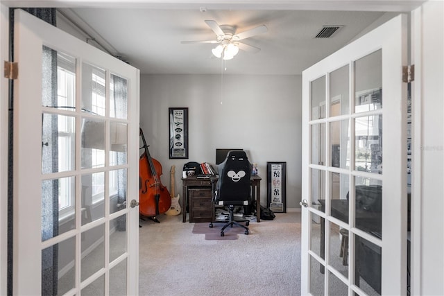 office space with french doors, carpet flooring, and a ceiling fan