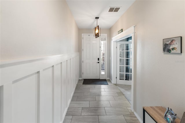 entrance foyer with a chandelier