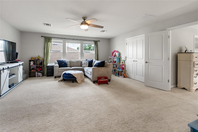 living room with light carpet and ceiling fan