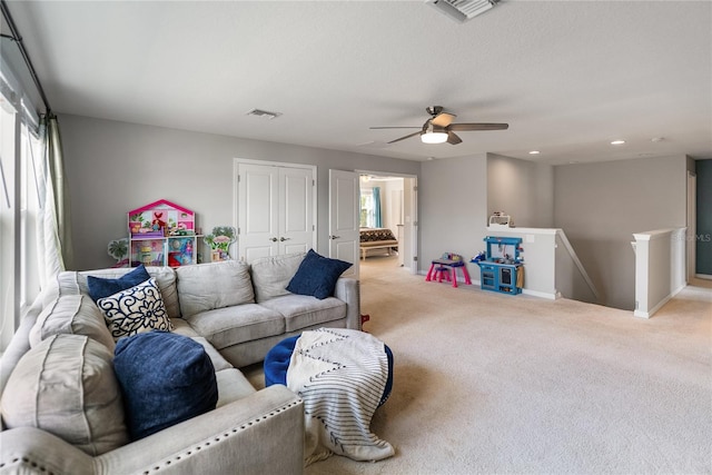 living room with carpet, a ceiling fan, recessed lighting, and baseboards