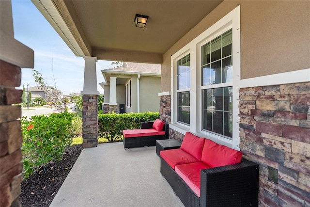 view of patio / terrace with covered porch and an outdoor living space