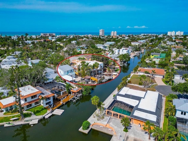 aerial view of residential area with a large body of water