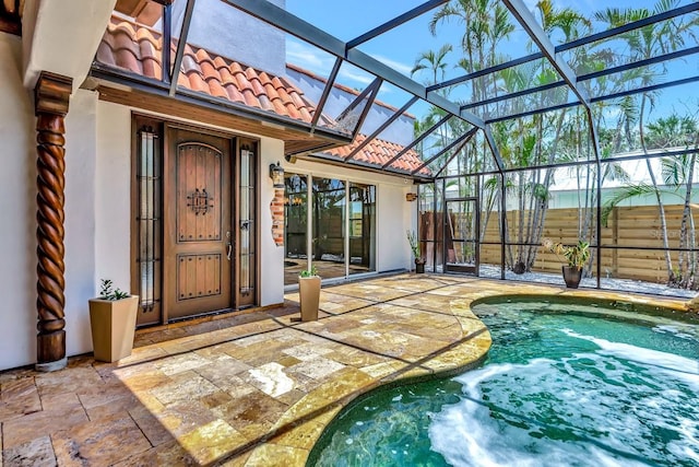 view of pool featuring a patio and glass enclosure