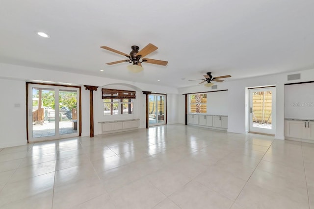 spare room featuring a ceiling fan, recessed lighting, light tile patterned flooring, and baseboards