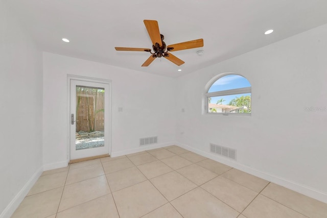 unfurnished room featuring recessed lighting, baseboards, light tile patterned floors, and ceiling fan
